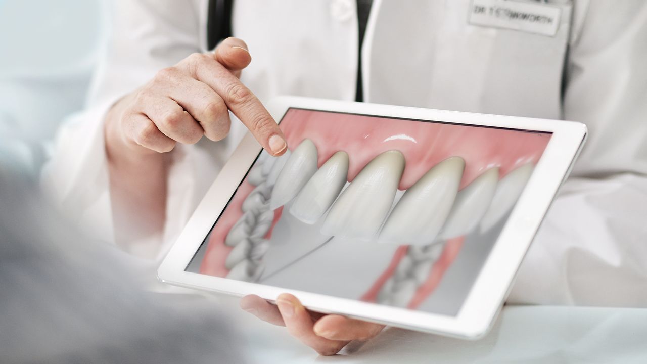 A doctor using ViewMedica On-Demand on an iPad device.