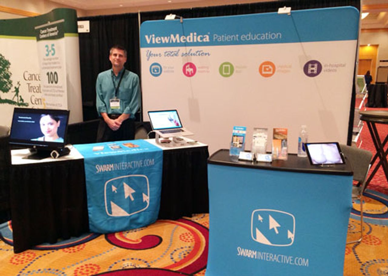 Don Wittekind poses in front of ViewMedicas booth at AAPM 2014.